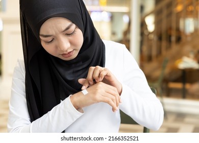 Muslim Woman Having Her Hand Wounded, First Aid Minor Injury Treatment Covering With Clean Bandage