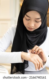 Muslim Woman Having Her Hand Wounded, First Aid Minor Injury Treatment Covering With Clean Bandage