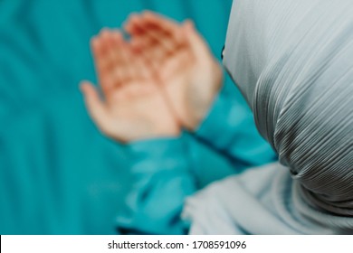 Muslim Woman In A Headscarf Praying (makes A Dua)