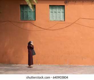 Muslim Woman In Hijab On Mobile Phone, Marrakesh, Morocco. 