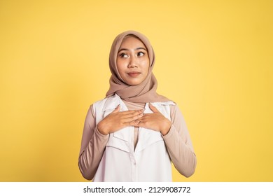 Muslim Woman Look Up Holding Chest While Feeling Relieved