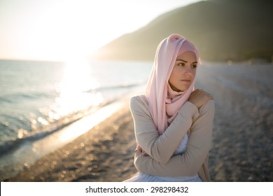 Muslim Woman On The Beach Spiritual Portrait.Humble Muslim Woman Praying On The Beach.Summer Holiday,muslim Woman Walking On The Beach