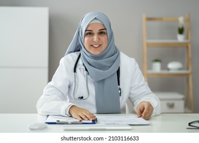 Muslim Woman Physician Doctor Video Conference Call - Powered by Shutterstock