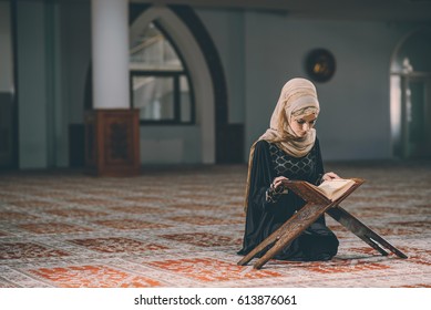 Muslim woman reading book