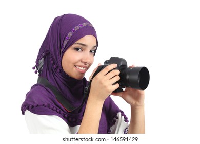 Muslim woman taking a photography with a slr camera isolated on a white background          - Powered by Shutterstock