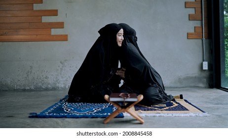 Muslim Woman In Traditional Clothing And Hijab Greeting To Each Other Elders, They Hug And Say Salam, As-salamu Alaykum