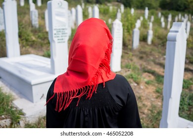 Muslim Woman Visiting Grave In Cemetery