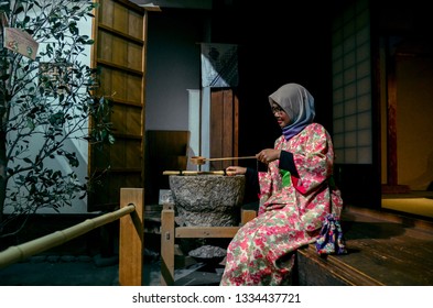 A Muslim Woman Wearing Kimono Posed In Front Of Japanese House In Osaka Museum Of Housing And Living