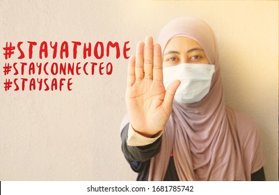 Muslim Woman Wearing Mask Showing Stop Sign To Stop Corona Virus With Hashtag Stay At Home Stay Connected And Stay Safe