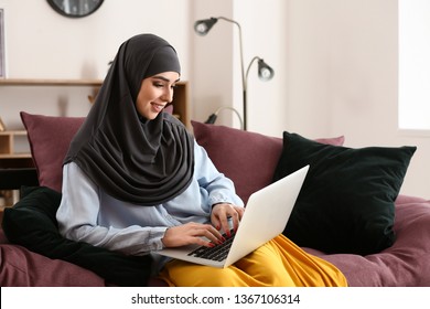 Muslim Woman Working On Laptop At Home