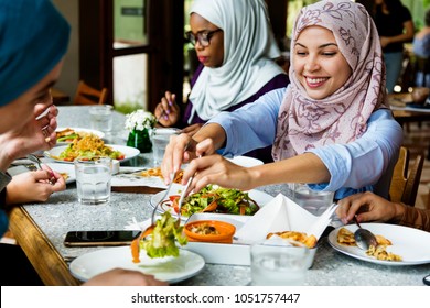 Muslim women hijab having dinner - Shutterstock ID 1051757447