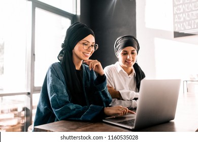 Muslim Women Hijab Working At Laptop Sitting In Office