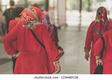 Muslim women are waiting for friends to travel together