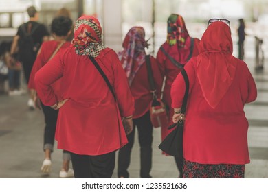 Muslim women are waiting for friends to travel together