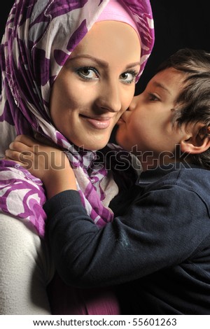 Muslim young woman with little cute kid