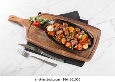 Muslims Traditional Sacrifice Holiday Food Lamb Fried Meat Stew On White Marble Table Background. Turkish Kavurma With Vegetables.