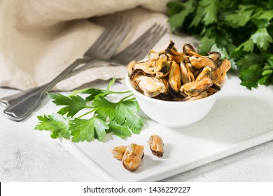 Mussel Meat In A White Bowl On A Light Table. Healthy Diet