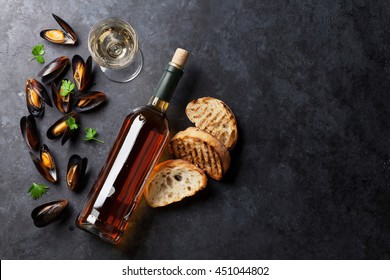 Mussels, Bread Toasts And White Wine On Stone Table. Top View With Copy Space