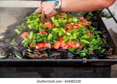  Mussels cooked with white and red wine sauce at mussels festival - Shutterstock ID 424482238