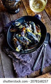 Mussels in creamy garlicky sauce - Shutterstock ID 2078168257