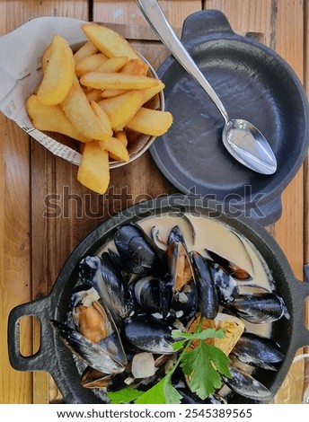 Similar – Image, Stock Photo Creamy mussels on wooden background