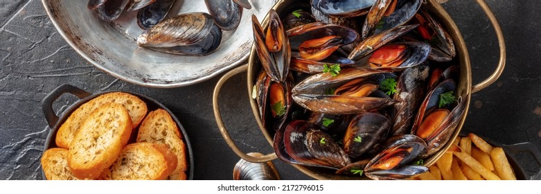 Mussels Panoramic Banner. Seafood Dinner With Shellfish And Toasted Bread, Shot From Above On A Dark Background