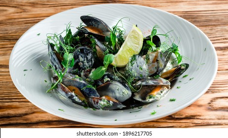 Mussels With Pepper And Lemon, Plate Of Mussels. Traditional French Corsican Mussel Stew With Mussels