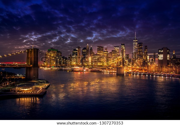 Must see when visiting New York City. View of\
Lower Manhattan and  Brooklyn at sunset. Night scene. Light trails.\
City lights. Urban living, travel, real estate  and transportation\
concept
