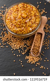 mustard in a bowl on a rustic background - Shutterstock ID 1119516719