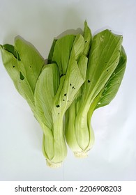 Mustard Greens Isolated On White Paper.