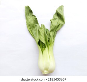 Mustard Greens Or Pakcoy Leaves Look Wilted Because They Are Cold And Moist Ready To Be Cooked, On A White Background