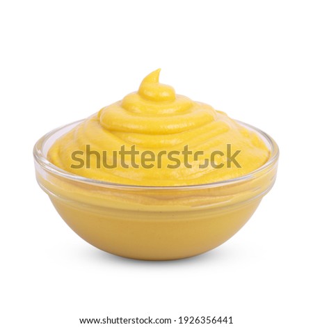 Mustard sauce in bowl isolated on white background