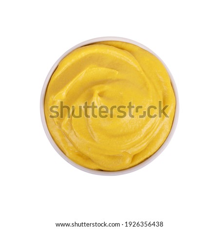 Mustard sauce in ceramic bowl isolated on white background.
