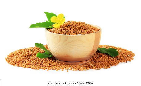 Mustard Seeds With Mustard Flower Isolated On White 