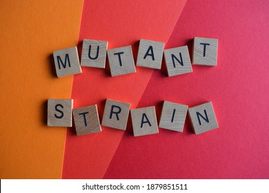 Mutant Strain, Words In Wooden Alphabet Letters On Red Background