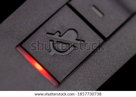 Mute button on a communication headset