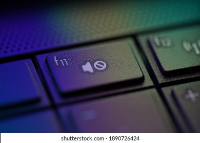 Mute Toggle Button On Laptop Keyboard With Gradient Light, Selective Focus. 