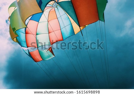 muticolor parachute against the blue sky