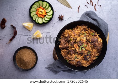 Mutton Biriyani on a black dish