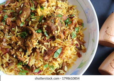 Mutton Biryani Or Lamb Pulao. Garnished With Fried Onion & Chopped Coriander. Biryani Is A Famous Spicy Non Vegetarian Dish Of India. Goat Meat Cooked Along With Basmati Rice & Spices. 