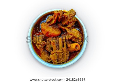 Mutton curry isolated on a white background, mutton kosha or masala in a white bowl, top view, red spicy gravy, Indian style meat dish. Indian cuisine