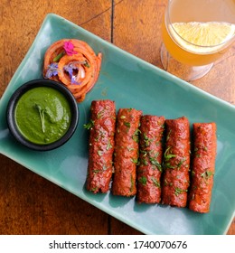 Mutton  Seekh Kebab With Chutney, Onions And Orange Drink