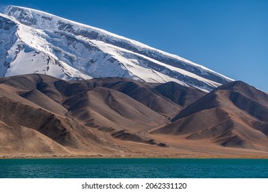 The Muztagh Ata Peak And The Lake Karakul.