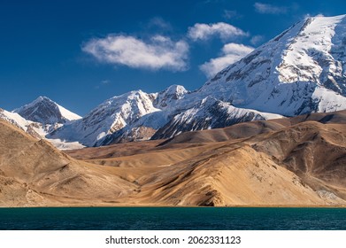 The Muztagh Ata Peak And The Lake Karakul.