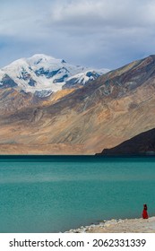 The Muztagh Ata Peak And The Lake Karakul.