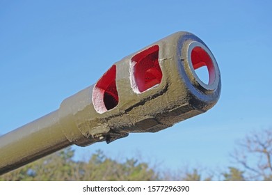 Muzzle Brake Heavy Cannon Against Blue Sky