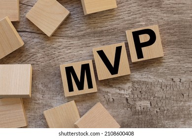 MVP, Minimum Viable Product Symbol. Text On Wood Blocks On A Wooden Table. Business And MVP, Minimum Viable Product Concept,