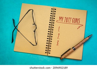 My 2022 Goals List In A Notebook With Pen And Reading Glasses, Setting New Year Goals And Resolutions