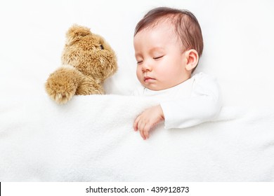 My Best Friend The Baby Sleeping With Her Teddy Bear On The Bed, New Family And Baby Healthy Concept