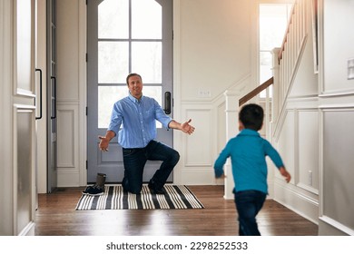 My boy. a father arriving home to a loving welcome from his son. - Powered by Shutterstock